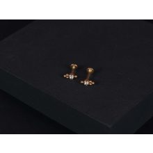 Piercing arany színű, hármas pötty kővel díszítítve