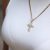   Cross - Gold female pendant nemesacél nyaklánc iced out köves kereszt medállal